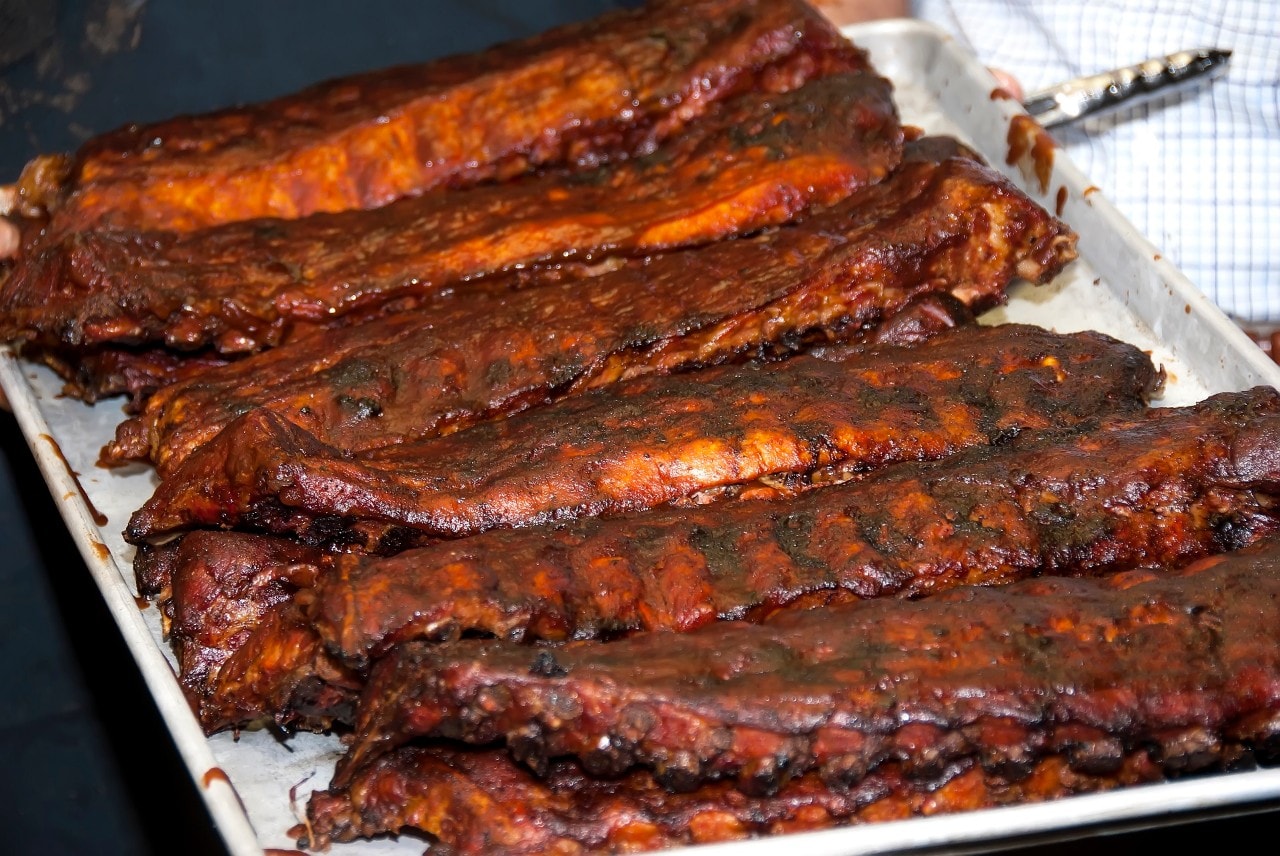 Tray of Kansas city-style barbecue whole pork barbecued spare ribs.