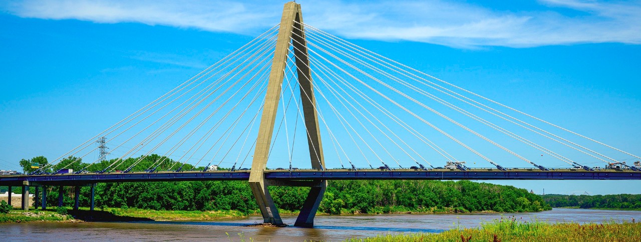 The Bond Bridge crossing the Missouri River and the beautiful wildflowers along the Riverfront Heritage Trail in Kansas City, Missouri